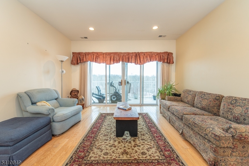 10323 Warren's Way Wanaque, NJ 07465 - Photo 2 of 30 a living room with furniture and a large window