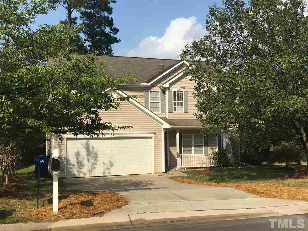 4841 Heatherfield Way Raleigh, NC 27604 - Photo 1 of 23 a front view of a house with garden