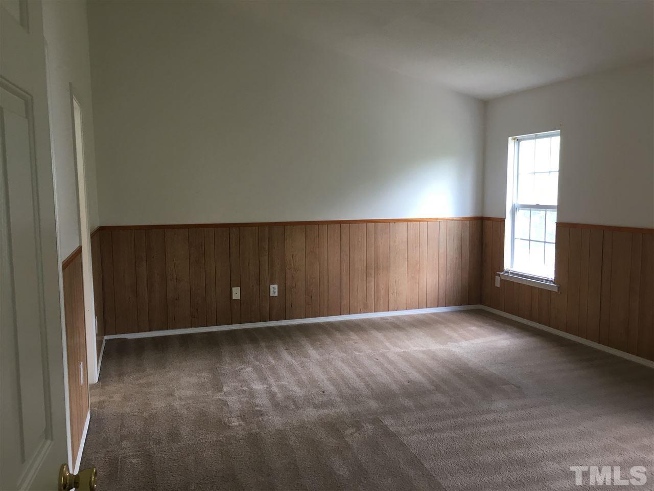 4841 Heatherfield Way Raleigh, NC 27604 - Photo 11 of 23 an empty room with windows