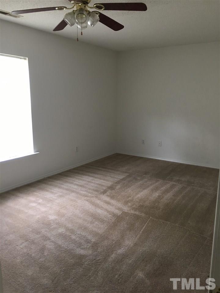 4841 Heatherfield Way Raleigh, NC 27604 - Photo 16 of 23 a view of an empty room with a window