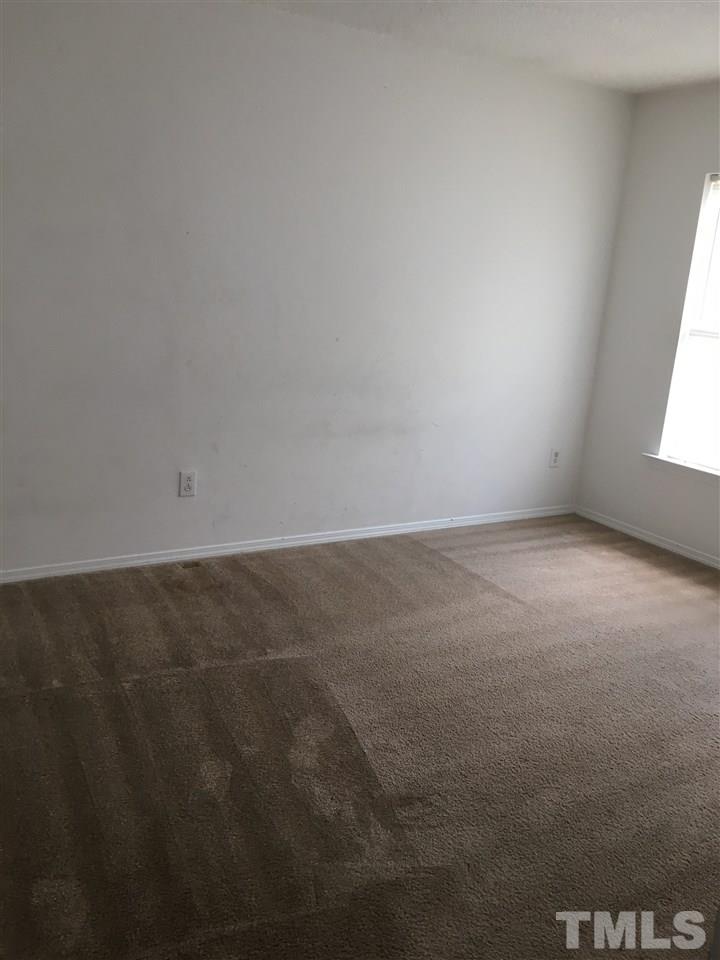 4841 Heatherfield Way Raleigh, NC 27604 - Photo 18 of 23 an empty room with a window
