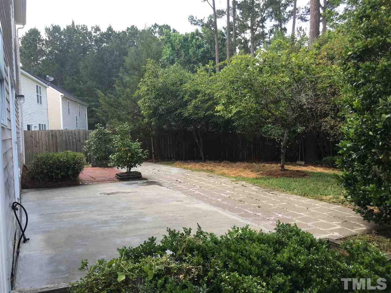 4841 Heatherfield Way Raleigh, NC 27604 - Photo 22 of 23 a house with trees in front of it