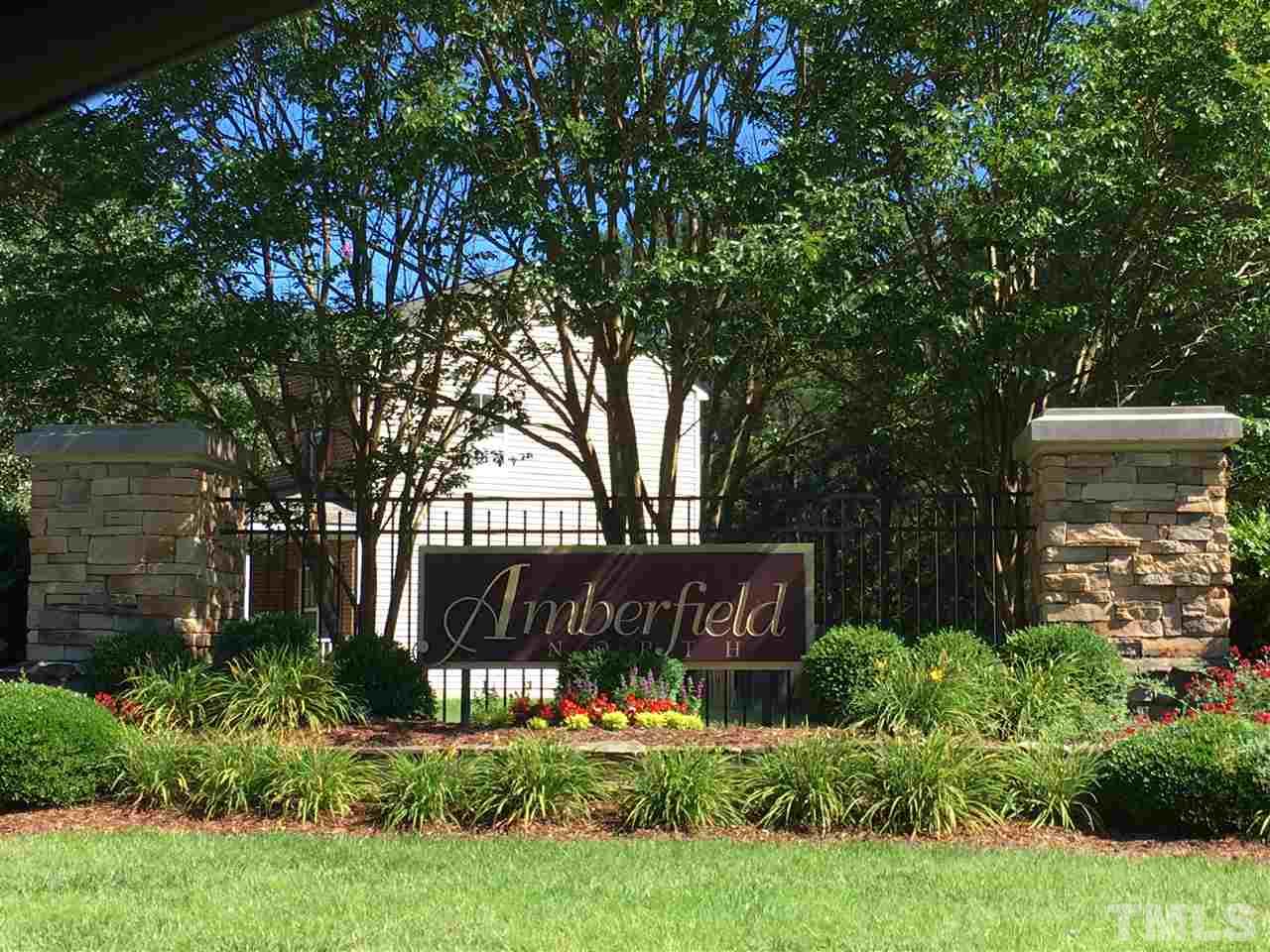 4841 Heatherfield Way Raleigh, NC 27604 - Photo 23 of 23 a view of a sign in a yard with potted plants and trees