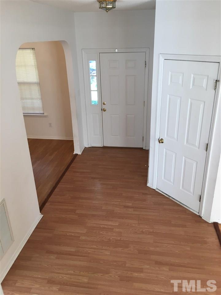 4841 Heatherfield Way Raleigh, NC 27604 - Photo 6 of 23 a view of hallway with wooden floor