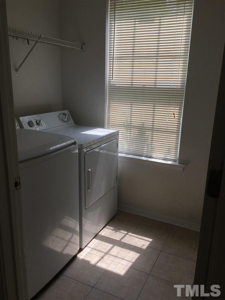 4841 Heatherfield Way Raleigh, NC 27604 - Photo 9 of 23 a utility room with dryer and washer