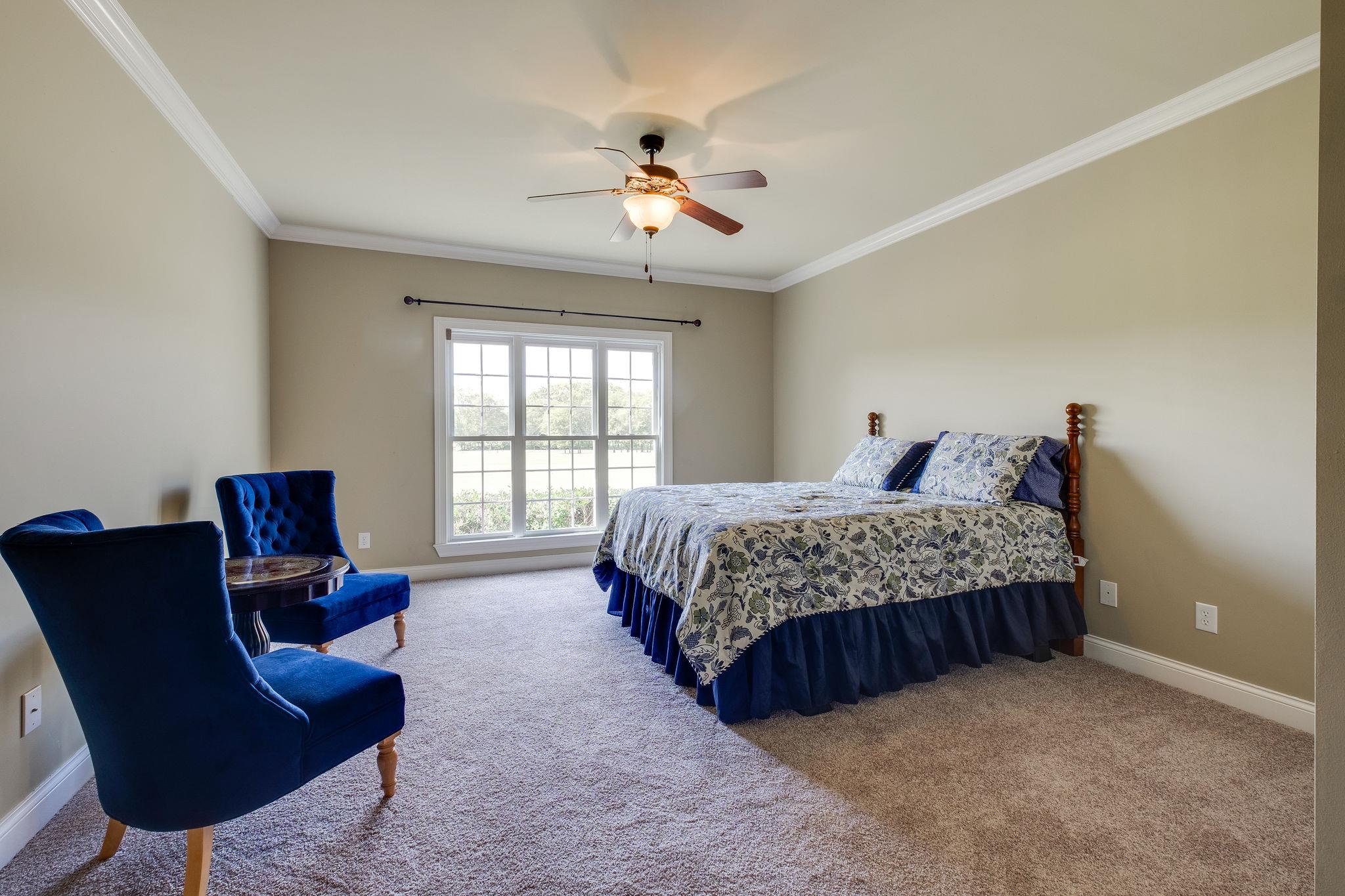 979 Franklin Road Gallatin, TN 37066 - Photo 24 of 24 a bedroom with a bed and chair