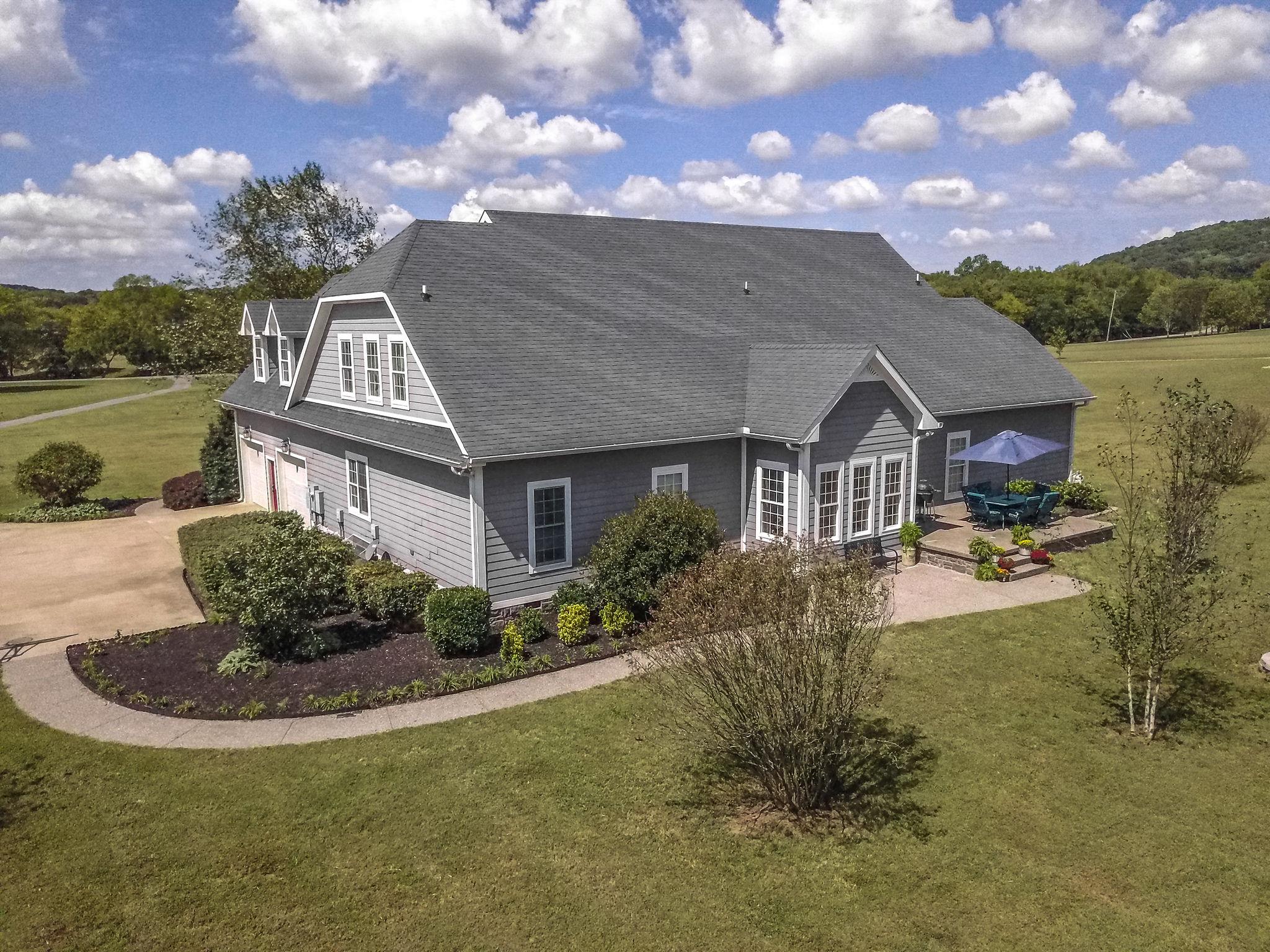 979 Franklin Road Gallatin, TN 37066 - Photo 5 of 24 a front view of house with yard and trees in the background