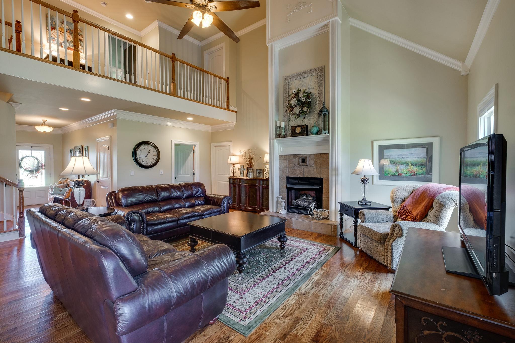 979 Franklin Road Gallatin, TN 37066 - Photo 10 of 24 a living room with furniture and a fireplace