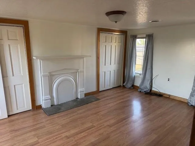 a view of a balcony with wooden floor