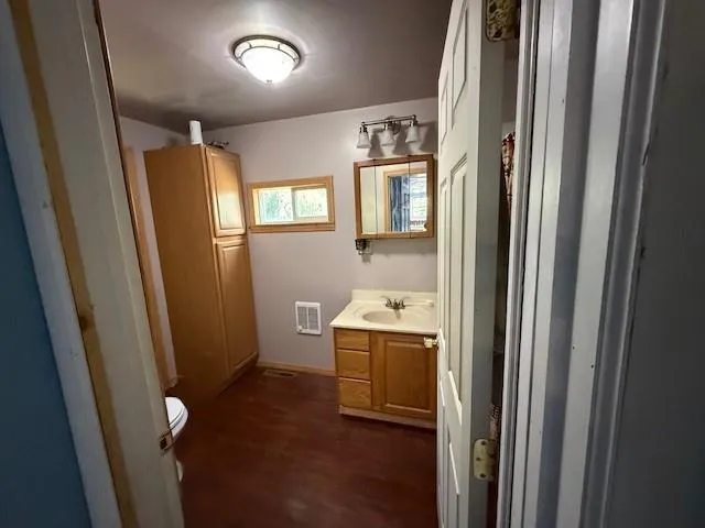 a view of empty room with a fireplace