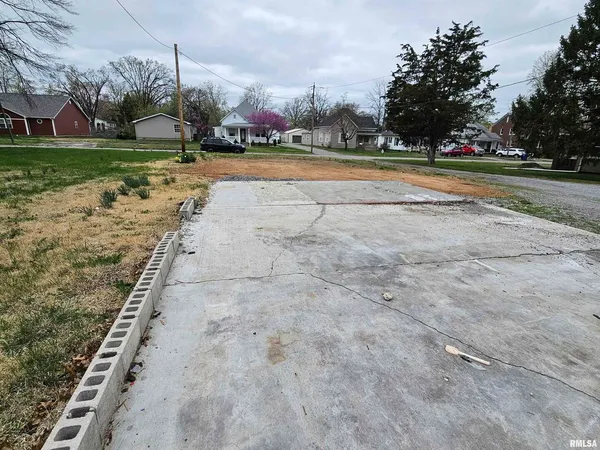 a view of a playground with basketball court