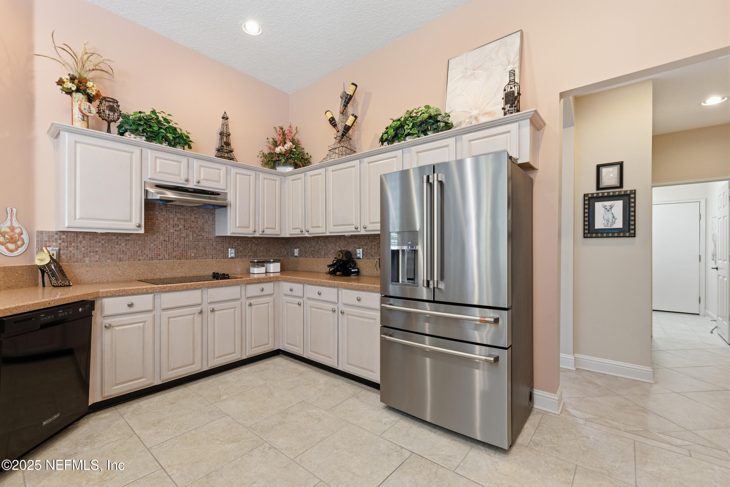 10044 Vineyard Lake Road East Jacksonville, FL 32256 - Photo 11 of 34 a kitchen with stainless steel appliances granite countertop a refrigerator sink and stove