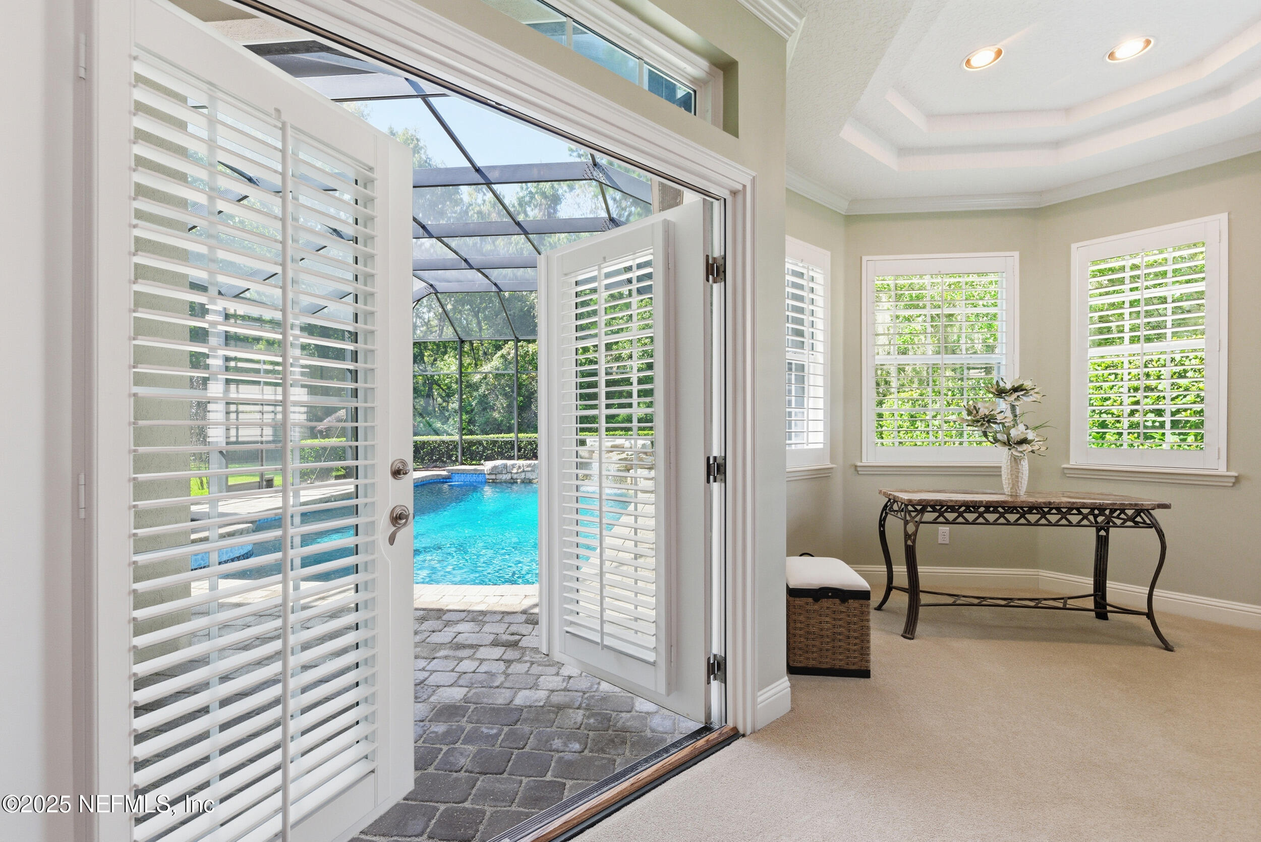 10044 Vineyard Lake Road East Jacksonville, FL 32256 - Photo 18 of 34 a view of a room with a large window and bed