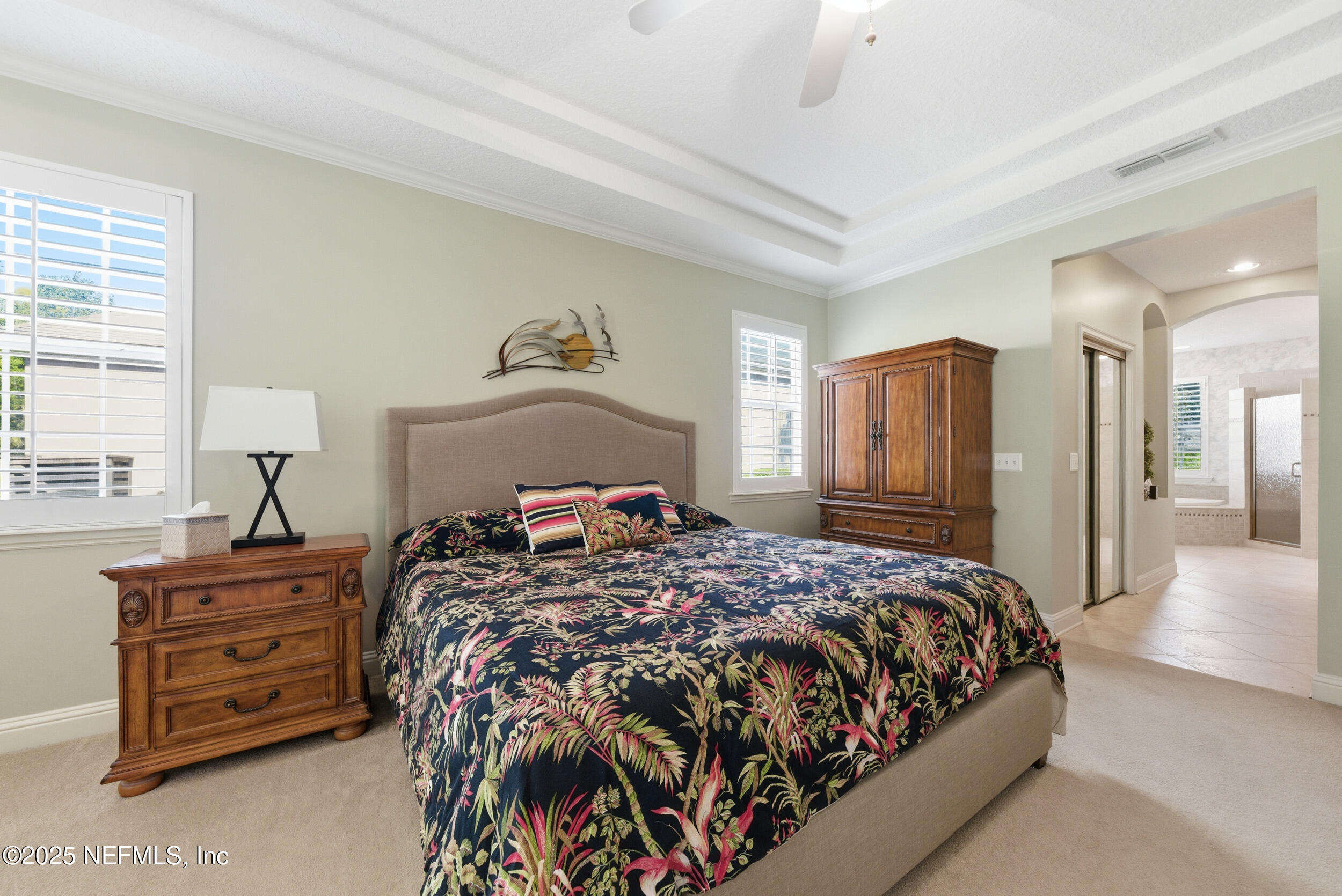 10044 Vineyard Lake Road East Jacksonville, FL 32256 - Photo 19 of 34 a bedroom with a bed and dresser