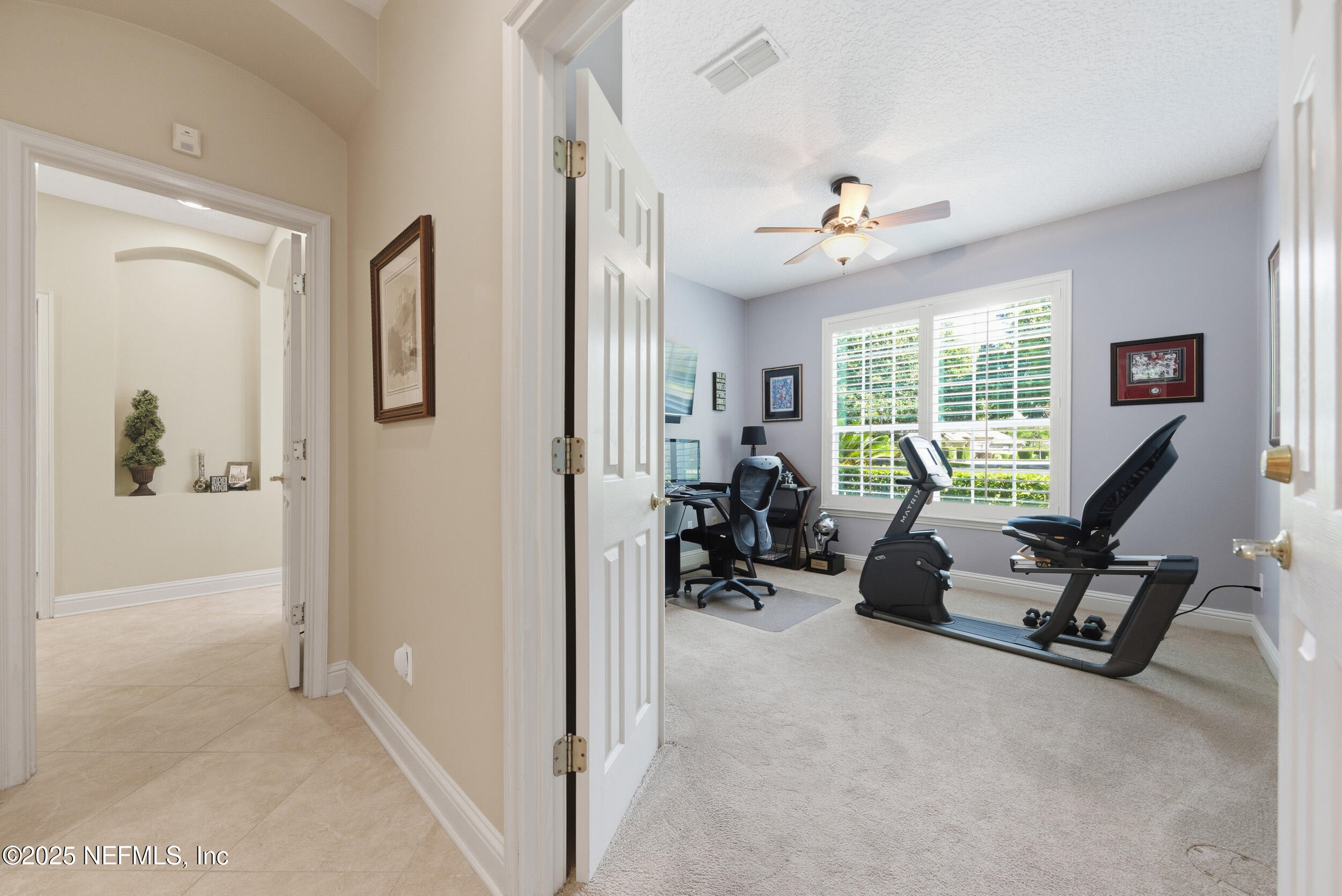 10044 Vineyard Lake Road East Jacksonville, FL 32256 - Photo 22 of 34 a view of a livingroom with couch and a window