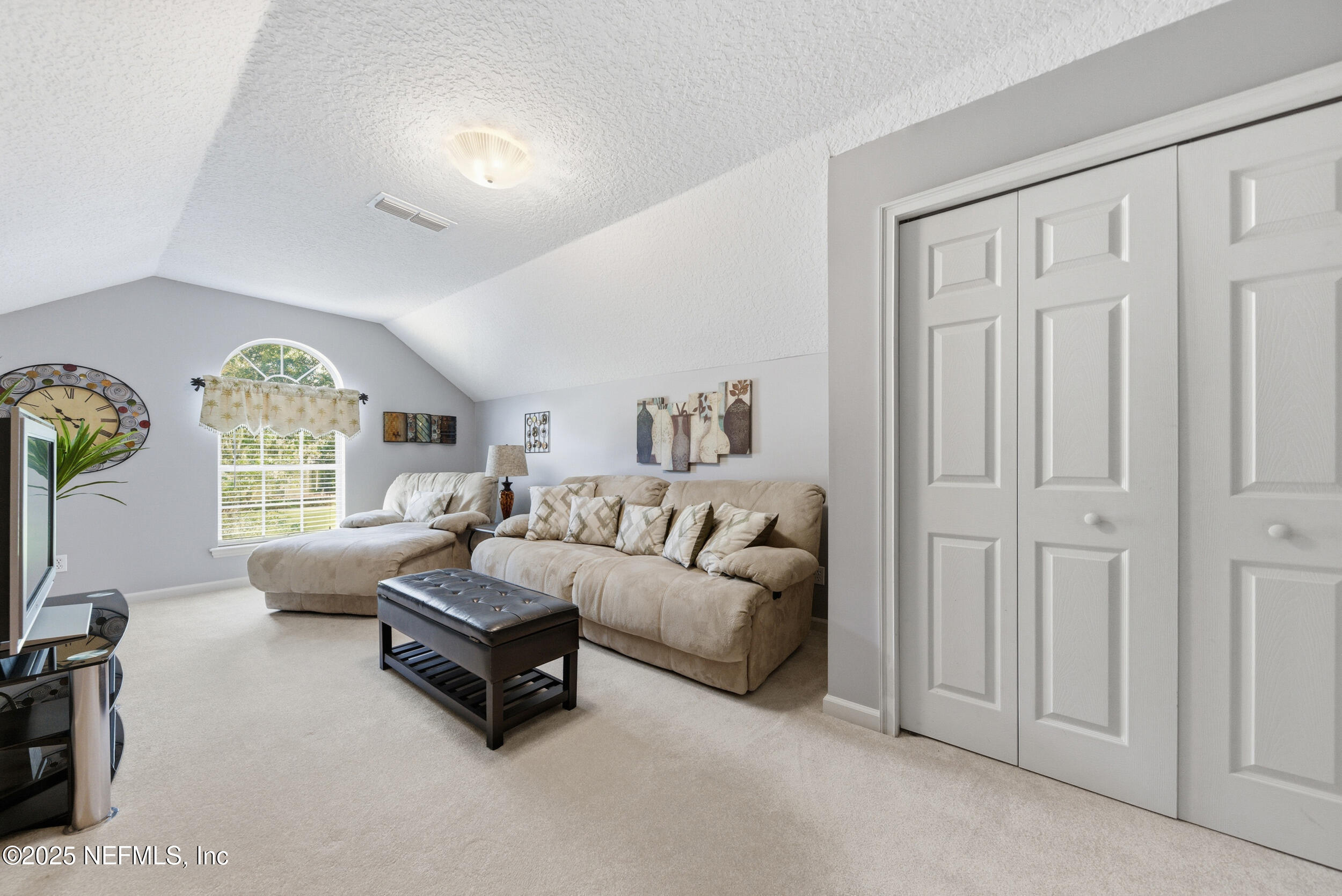 10044 Vineyard Lake Road East Jacksonville, FL 32256 - Photo 26 of 34 a living room with furniture and a large window