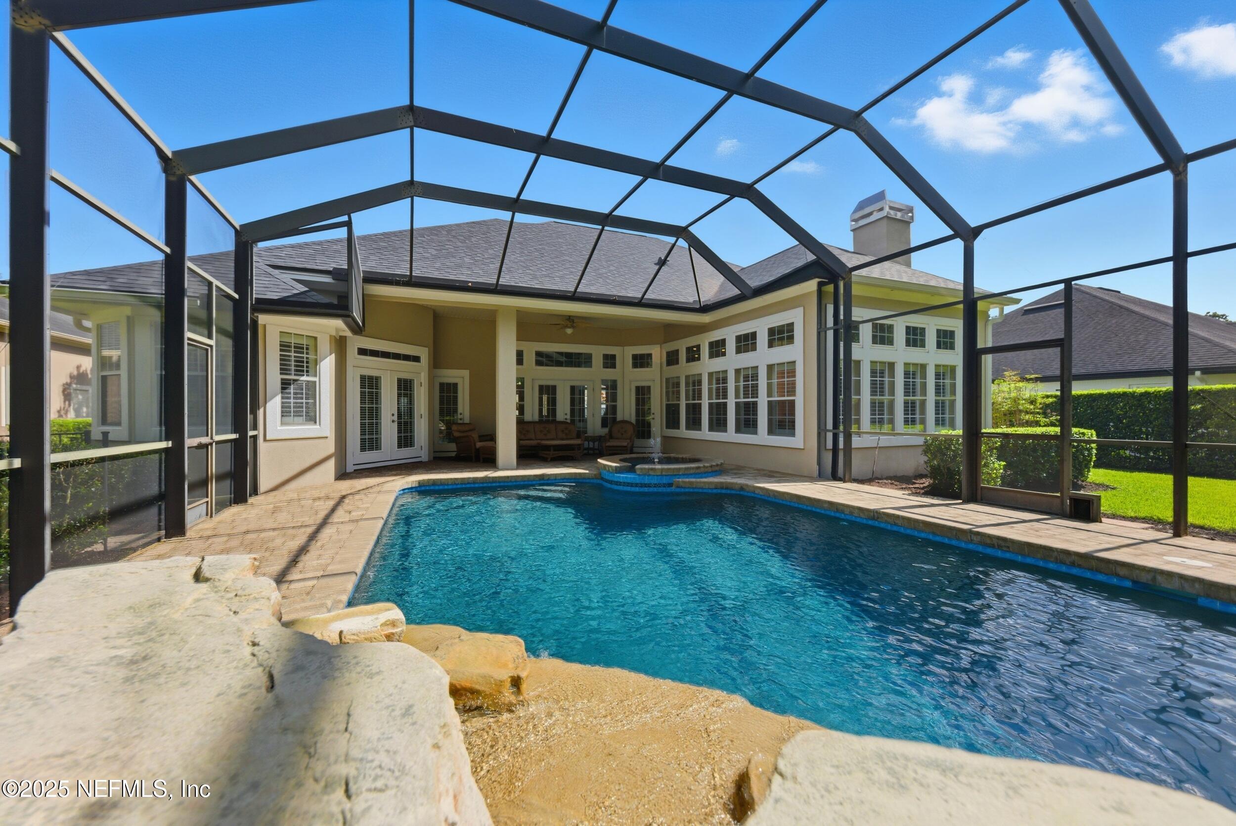 10044 Vineyard Lake Road East Jacksonville, FL 32256 - Photo 31 of 34 a view of a backyard with porch and a patio