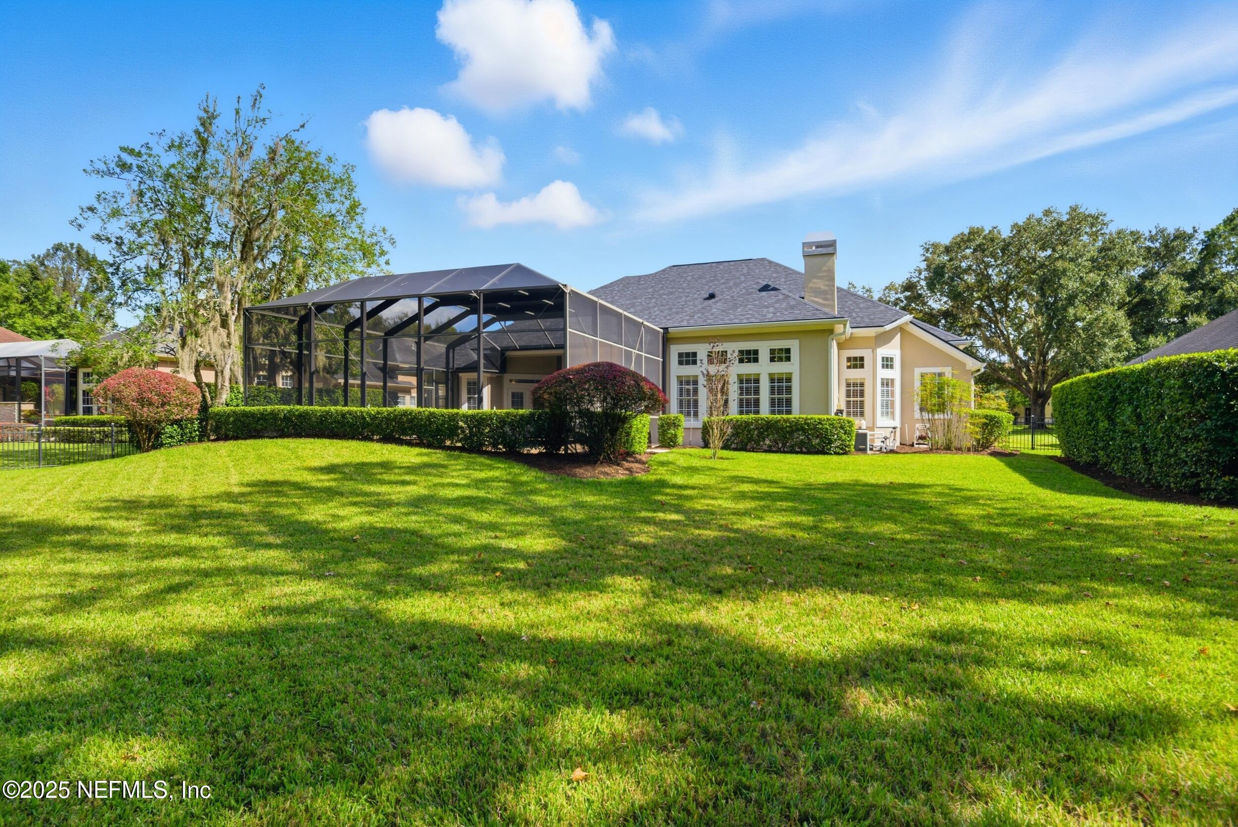 10044 Vineyard Lake Road East Jacksonville, FL 32256 - Photo 34 of 34 a front view of house with yard and green space