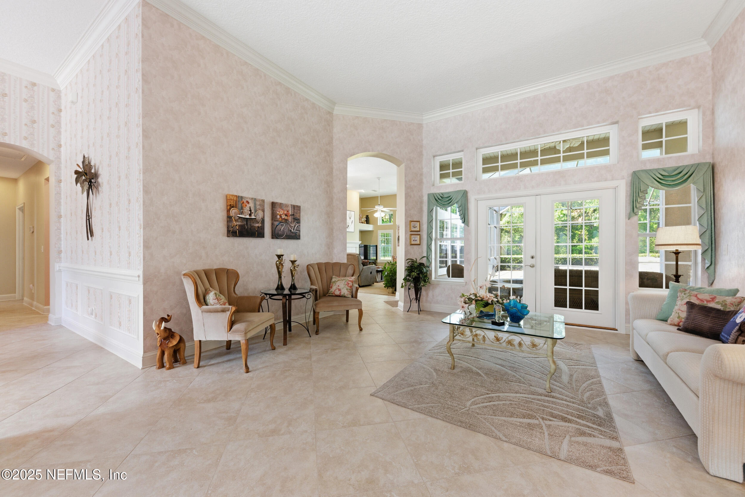 10044 Vineyard Lake Road East Jacksonville, FL 32256 - Photo 7 of 34 a living room with furniture and a large window