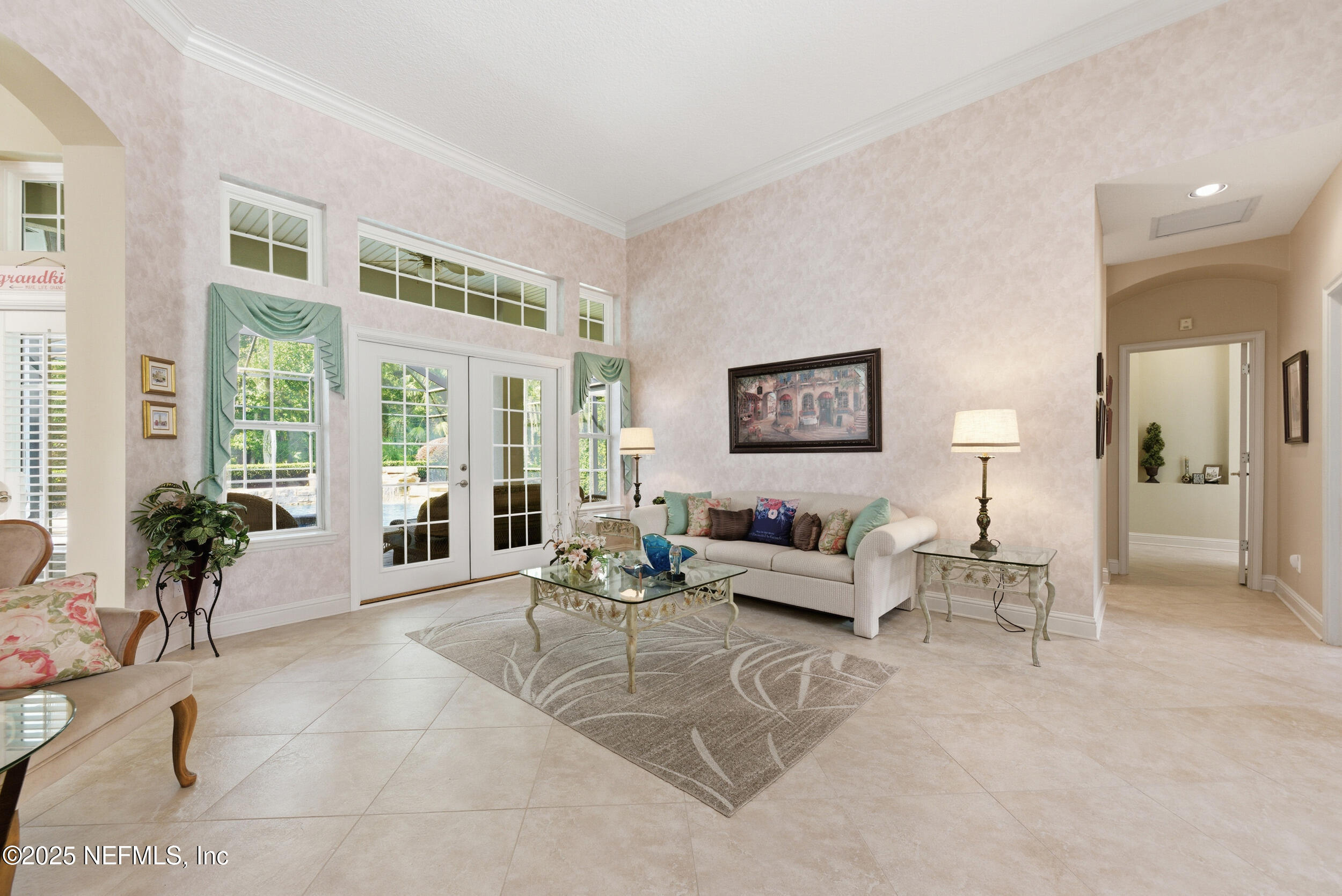 10044 Vineyard Lake Road East Jacksonville, FL 32256 - Photo 8 of 34 a living room with furniture and large windows
