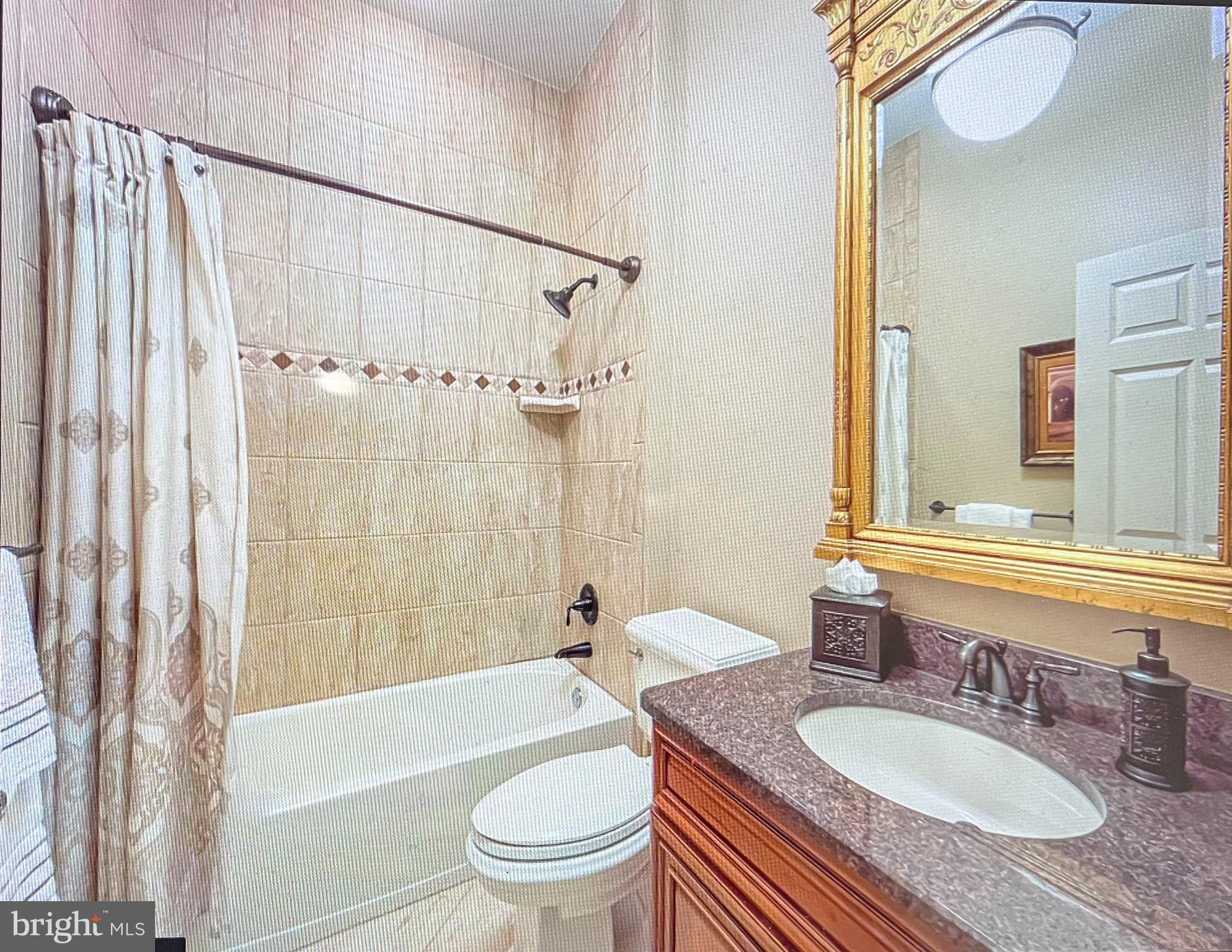 209 Regency Boulevard Yardley, PA 19067 - Photo 21 of 58 a bathroom with a granite countertop sink toilet a mirror and shower