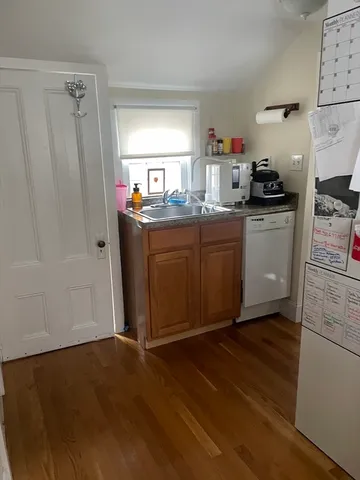 a view of a house with wooden deck