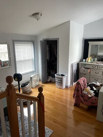 a bedroom with a bed and a table in it