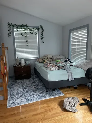a kitchen with a stove top oven and a refrigerator