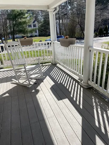 a view of balcony with wooden floor