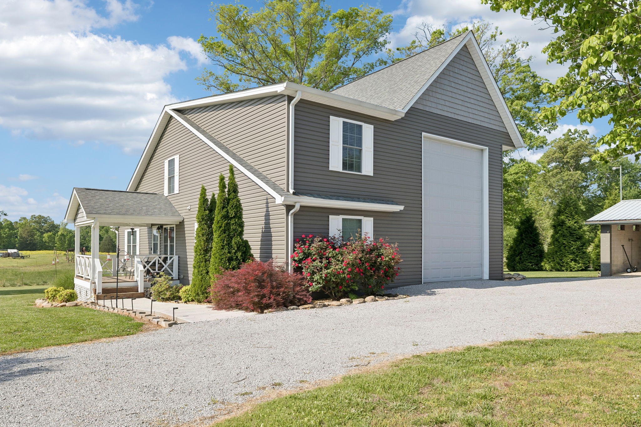 403 Bland Road Estill Springs, TN 37330 - Photo 4 of 66 a front view of a house with garden