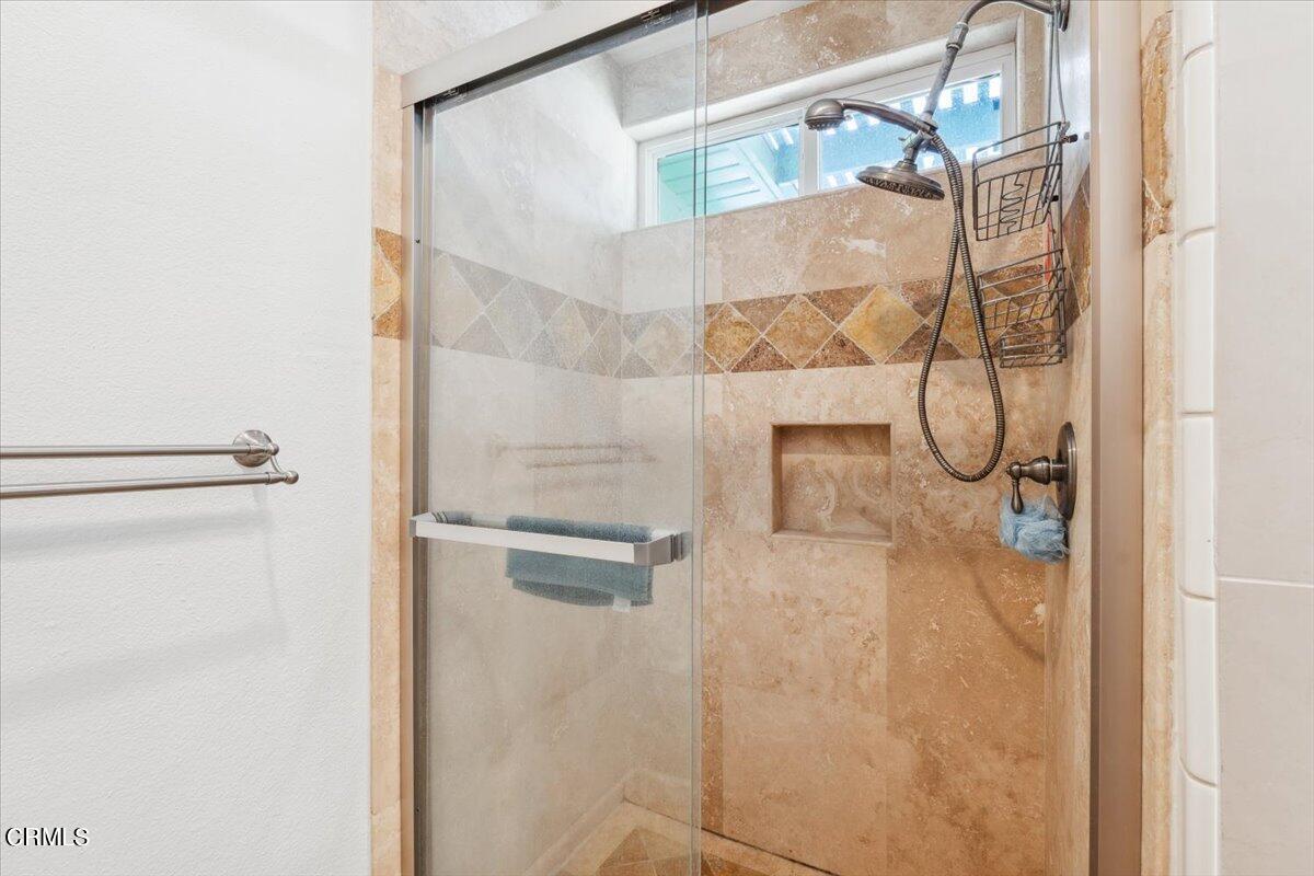 111 Bottlebrush Circle Oxnard, CA 93030 - Photo 27 of 44 a bathroom with a glass shower door