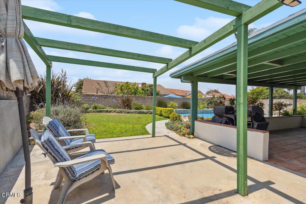 111 Bottlebrush Circle Oxnard, CA 93030 - Photo 33 of 44 a view of a patio with a table chairs and a backyard