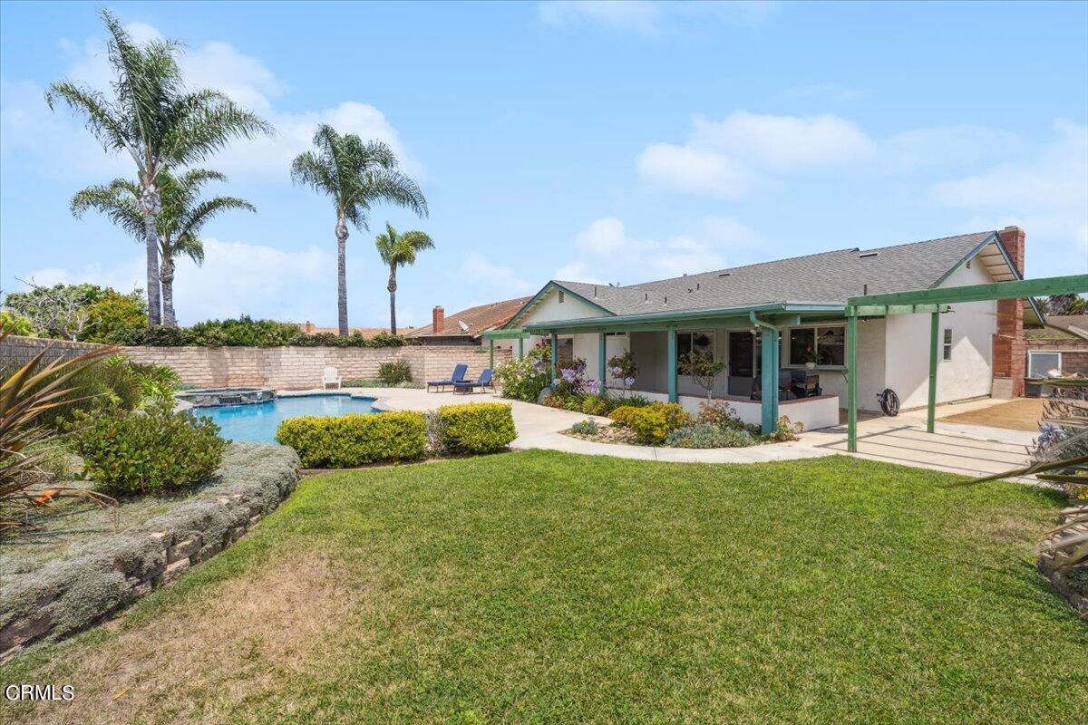 111 Bottlebrush Circle Oxnard, CA 93030 - Photo 35 of 44 a view of a house with swimming pool and a yard