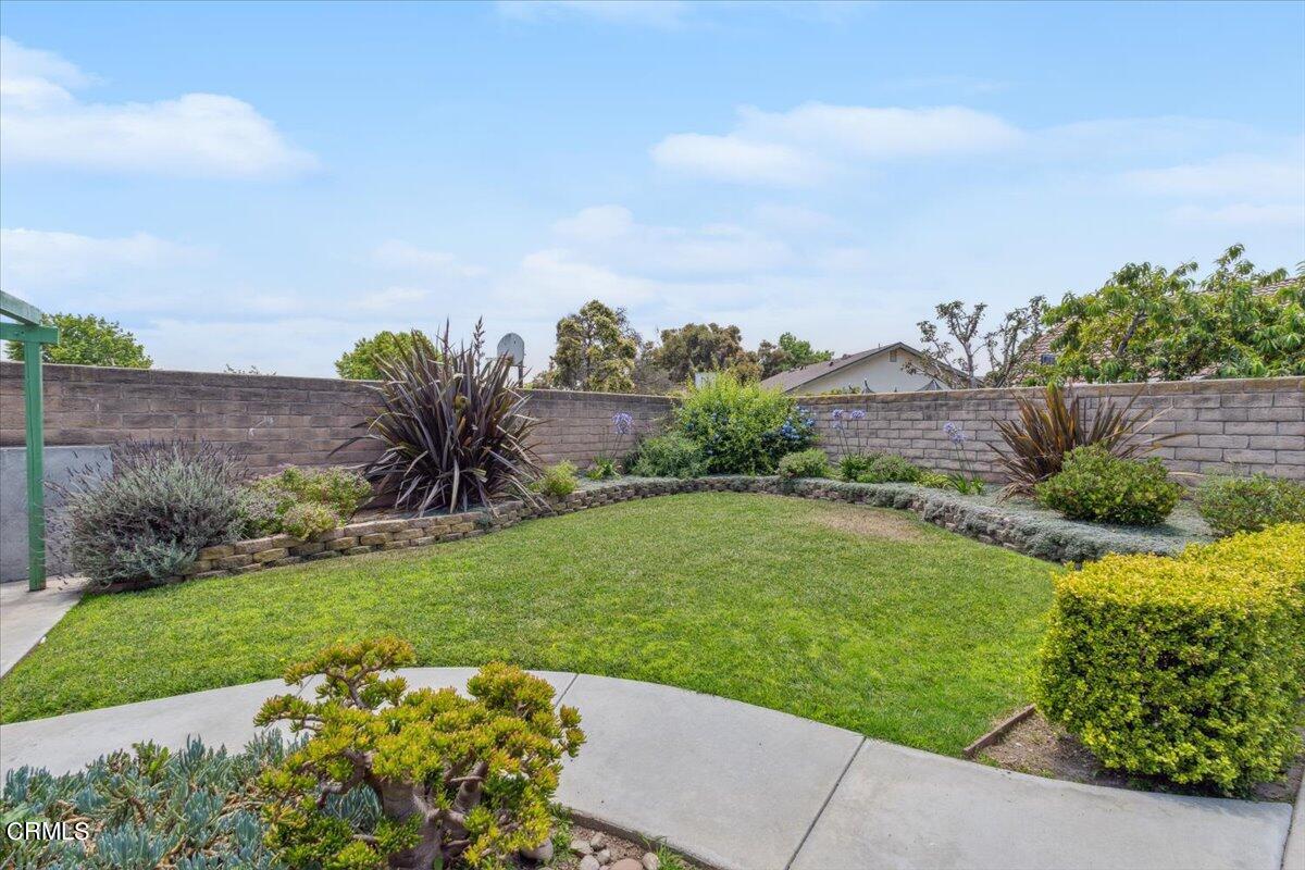 111 Bottlebrush Circle Oxnard, CA 93030 - Photo 37 of 44 a view of a garden with a building in the background