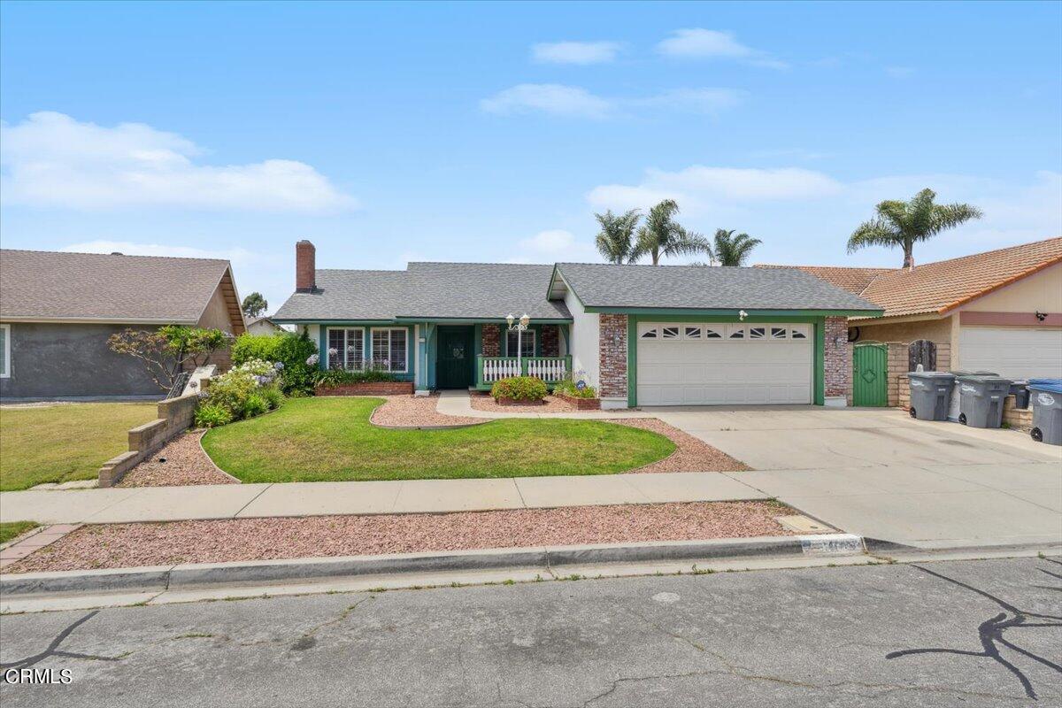 111 Bottlebrush Circle Oxnard, CA 93030 - Photo 41 of 44 a front view of a house with a yard and garage