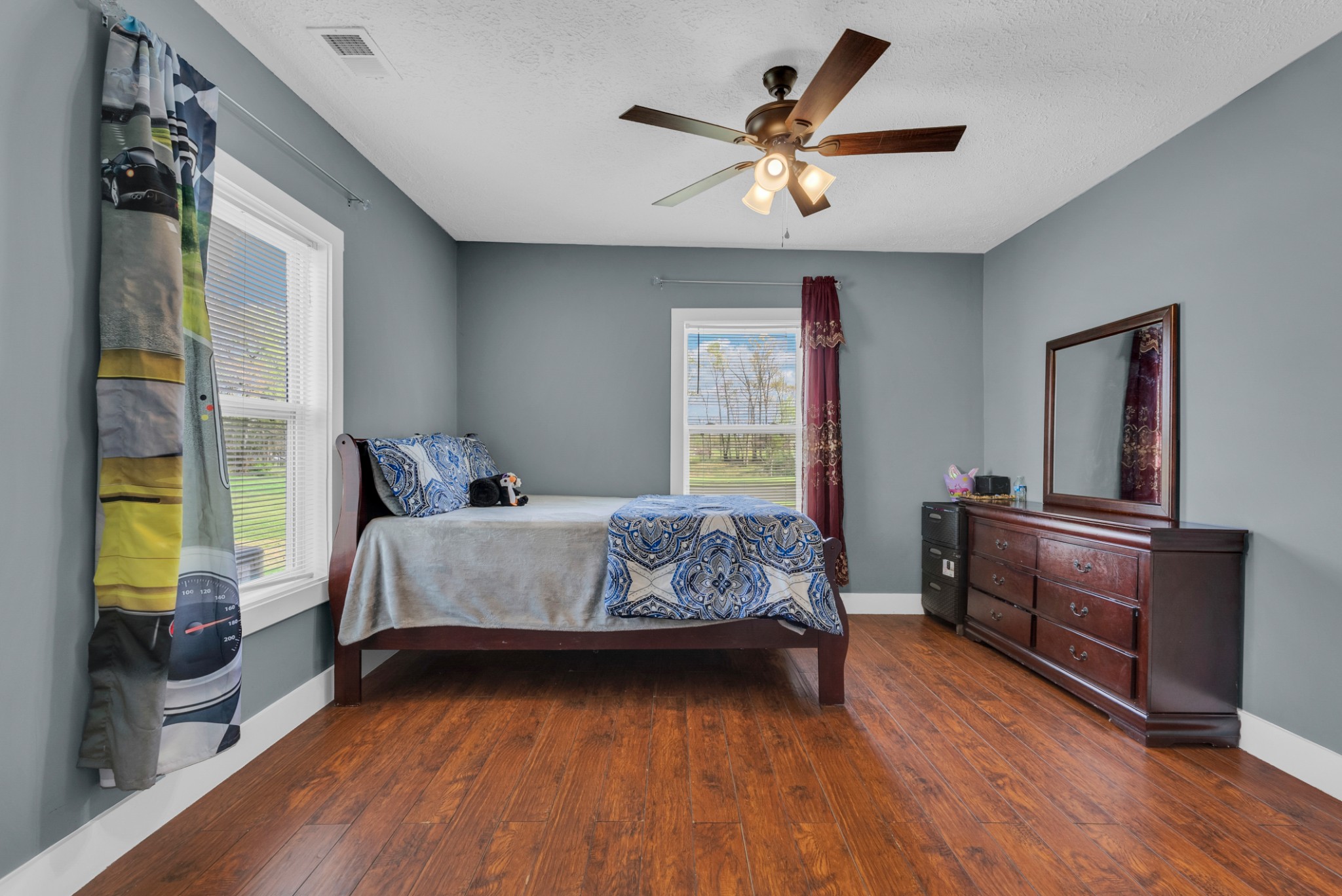 320 West King Street Morrison, TN 37357 - Photo 15 of 29 a bedroom with a bed and a chandelier
