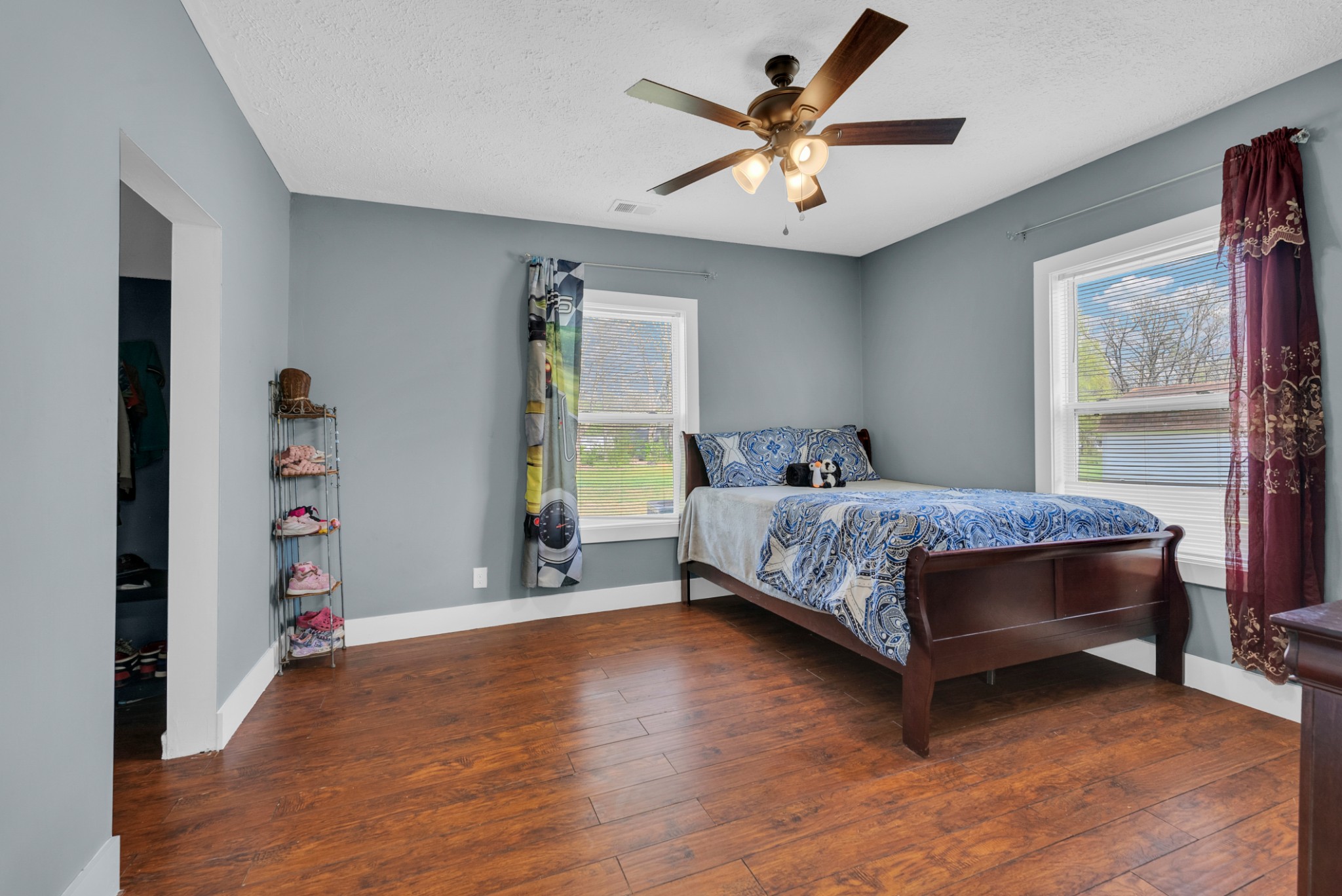 320 West King Street Morrison, TN 37357 - Photo 16 of 29 a bedroom with a bed and a chandelier