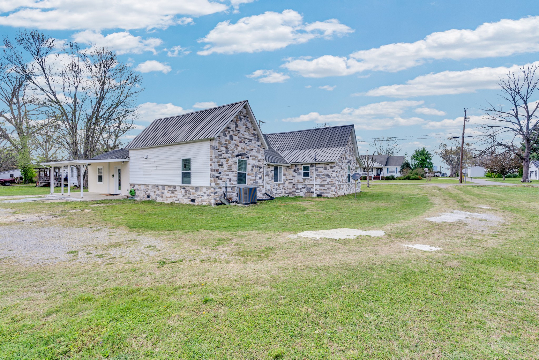 320 West King Street Morrison, TN 37357 - Photo 22 of 29 a view of a house with a yard
