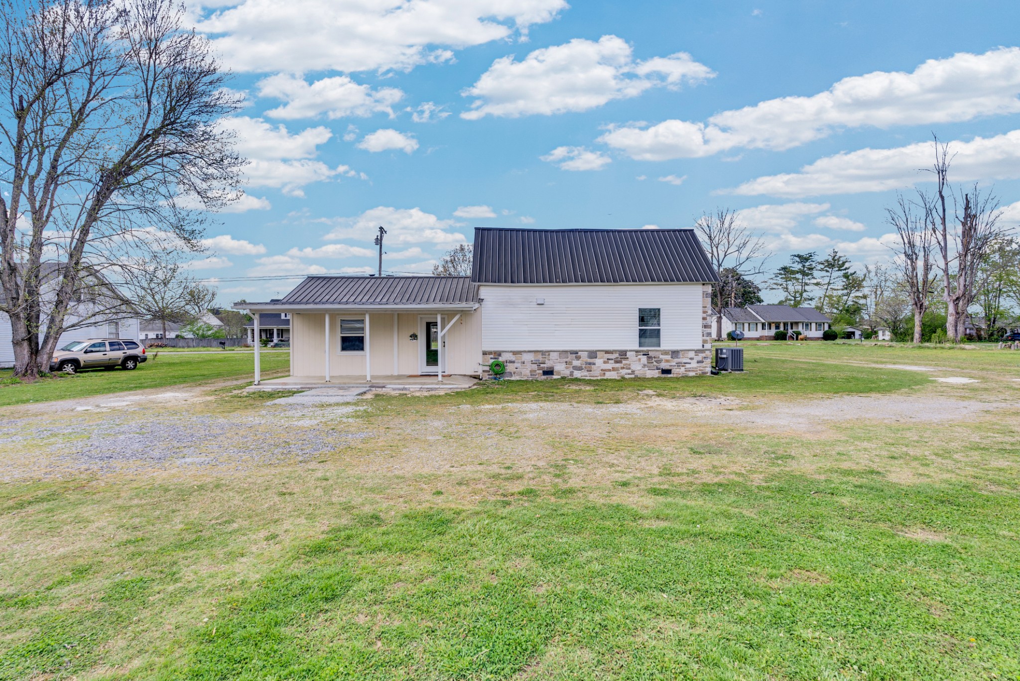 320 West King Street Morrison, TN 37357 - Photo 23 of 29 front view of a house with a yard