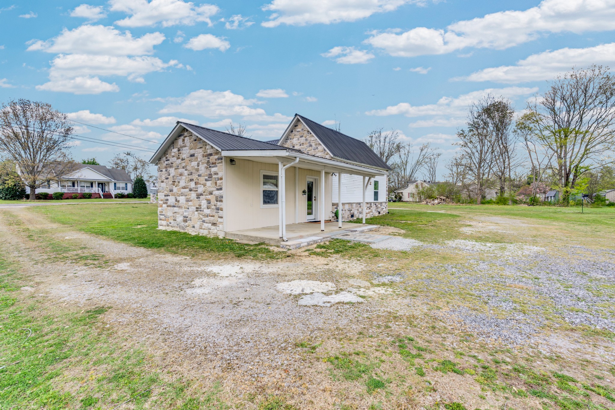 320 West King Street Morrison, TN 37357 - Photo 24 of 29 a view of a house with a yard and large trees