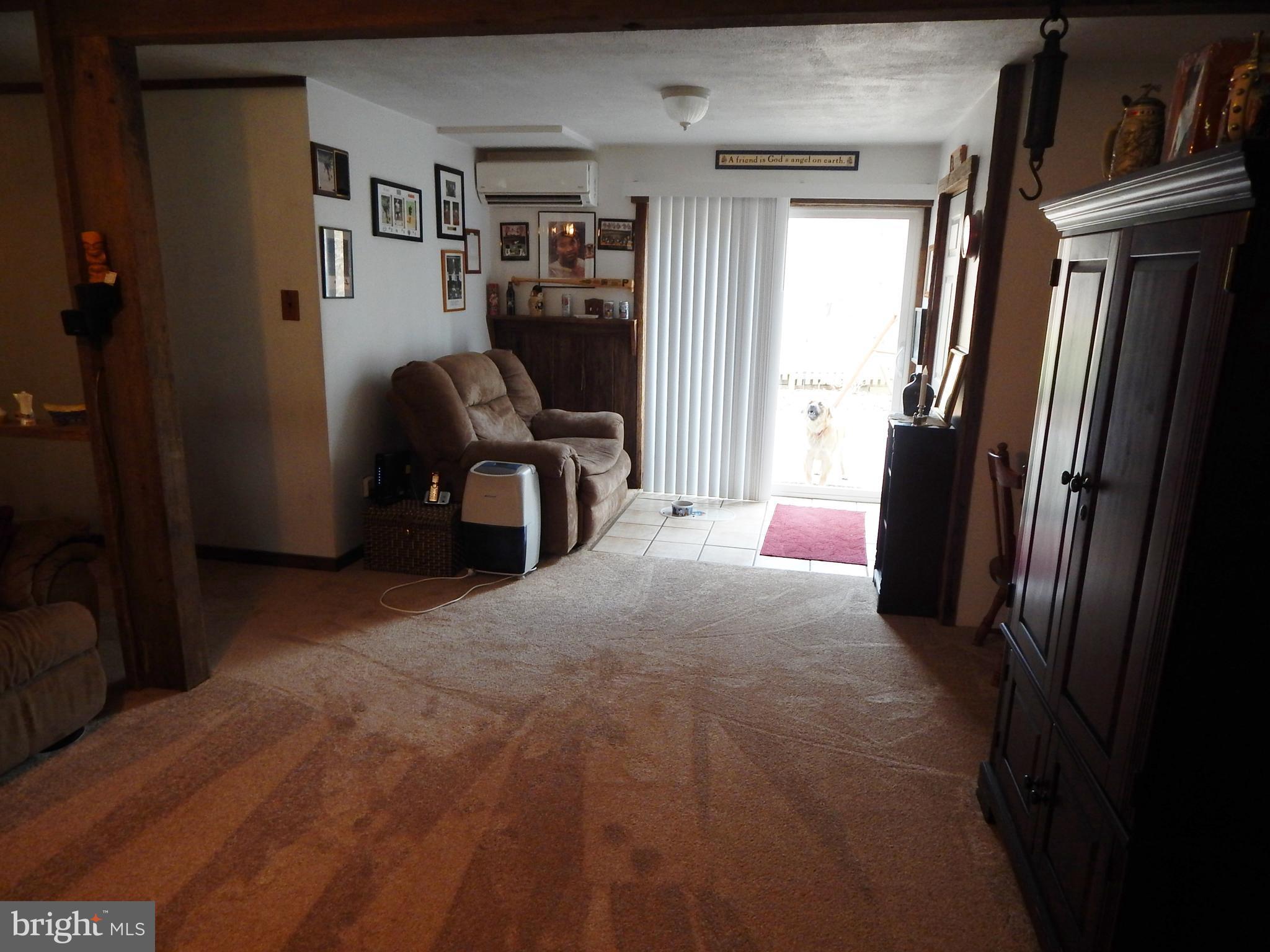 6053 Hill Road St. Leonard, MD 20685 - Photo 20 of 28 Family Room with view to sliding door to backyard