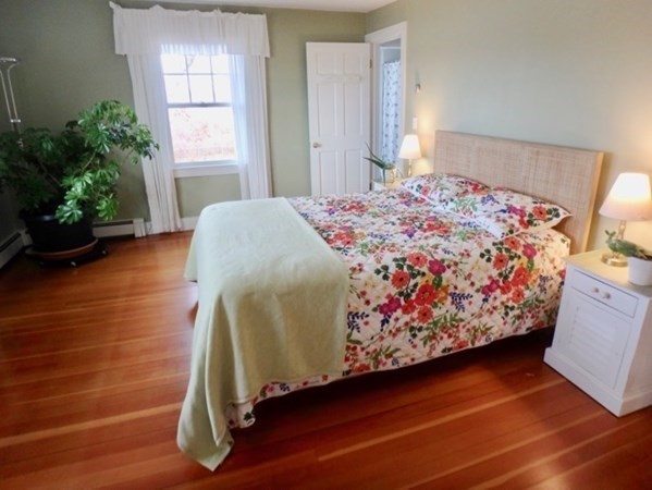 74 Turkeyland Cove Road Edgartown, MA 02539 - Photo 15 of 23 a bedroom with a bed and a window