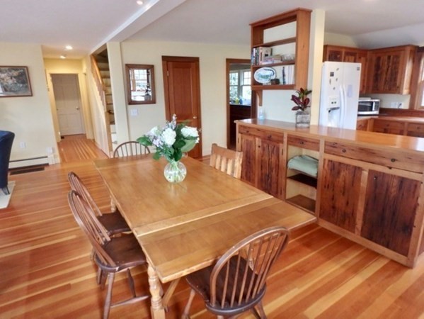 74 Turkeyland Cove Road Edgartown, MA 02539 - Photo 2 of 23 a dining room with furniture and wooden floor