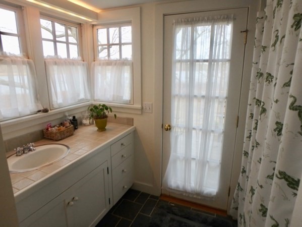 74 Turkeyland Cove Road Edgartown, MA 02539 - Photo 22 of 23 a bathroom with a sink and a window