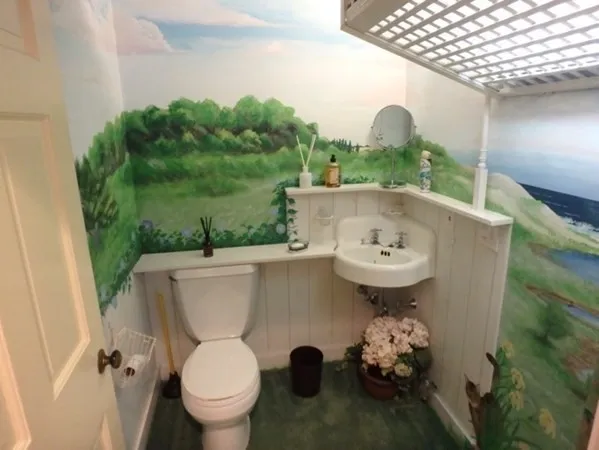 a view of a bathroom with a sink and mirror