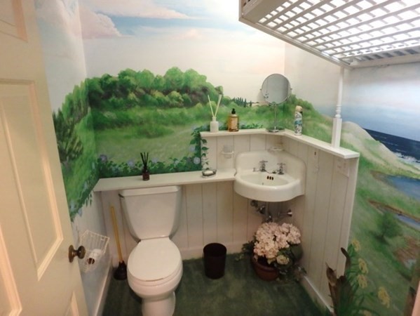 74 Turkeyland Cove Road Edgartown, MA 02539 - Photo 23 of 23 a view of a bathroom with a sink and mirror