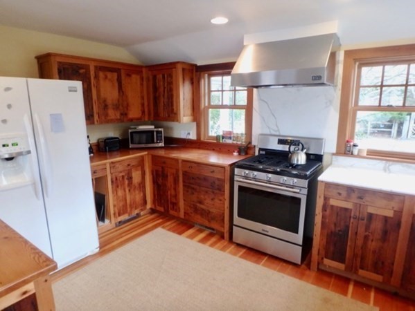 74 Turkeyland Cove Road Edgartown, MA 02539 - Photo 6 of 23 a kitchen with stainless steel appliances granite countertop a stove a refrigerator and a stove