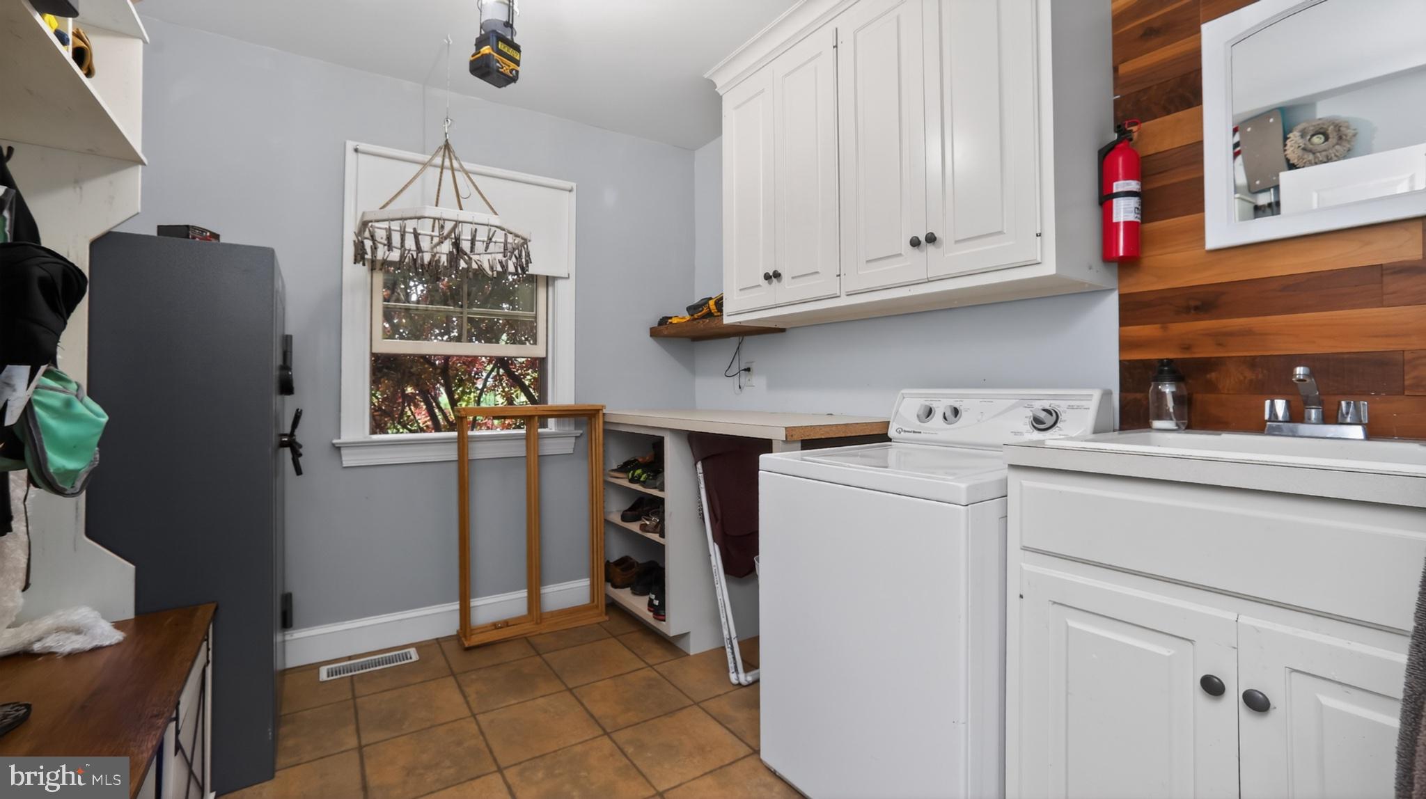 5325 Hammond Road New Holland, PA 17557 - Photo 7 of 73 Charming laundry room with modern flair.