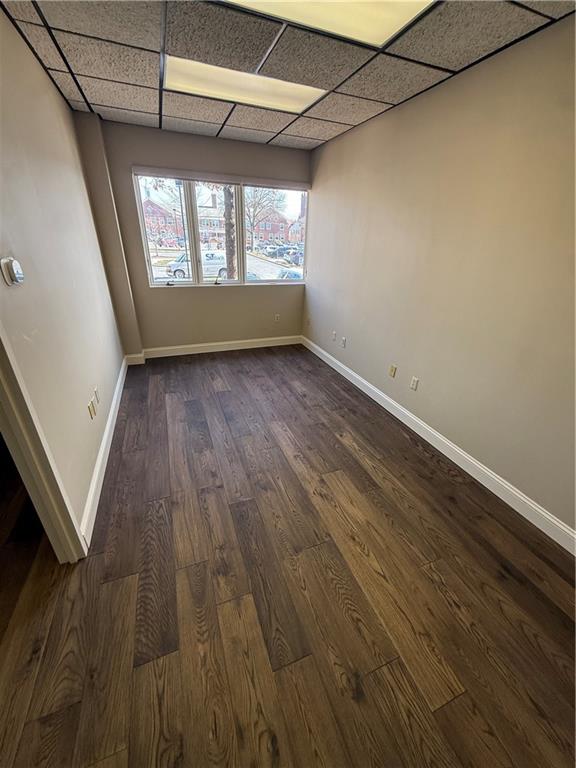 43 South 9th Street, Unit 101 Indiana, PA 15701 - Photo 6 of 9 an empty room with wooden floor and windows