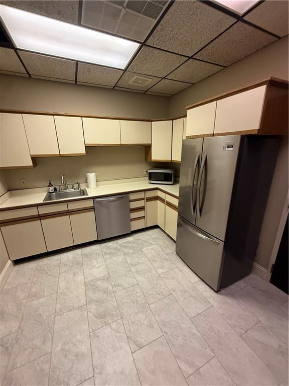 43 South 9th Street, Unit 101 Indiana, PA 15701 - Photo 7 of 9 a kitchen with stainless steel appliances granite countertop a refrigerator and a sink